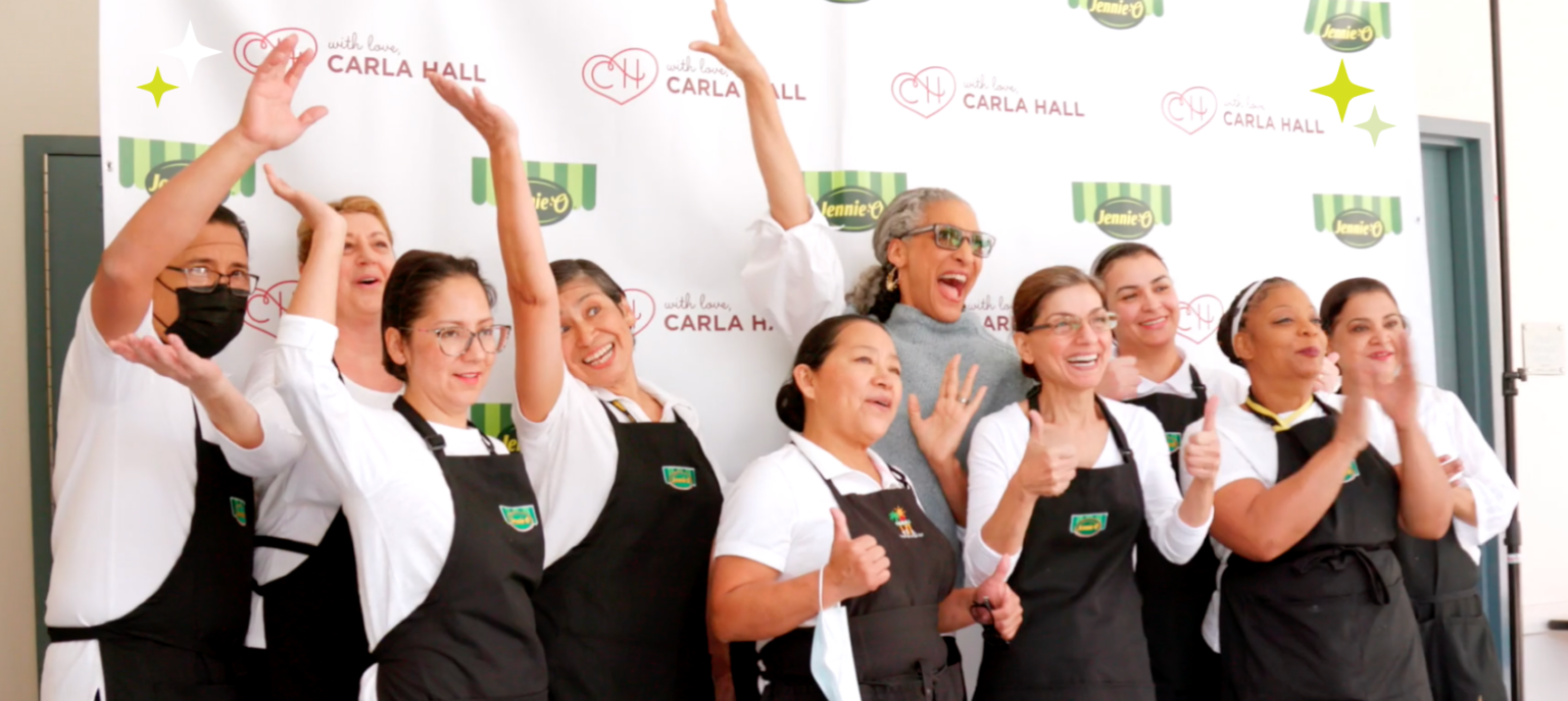 Carla Hall with Cooks